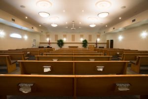 chapel pews facing alter, memorial service